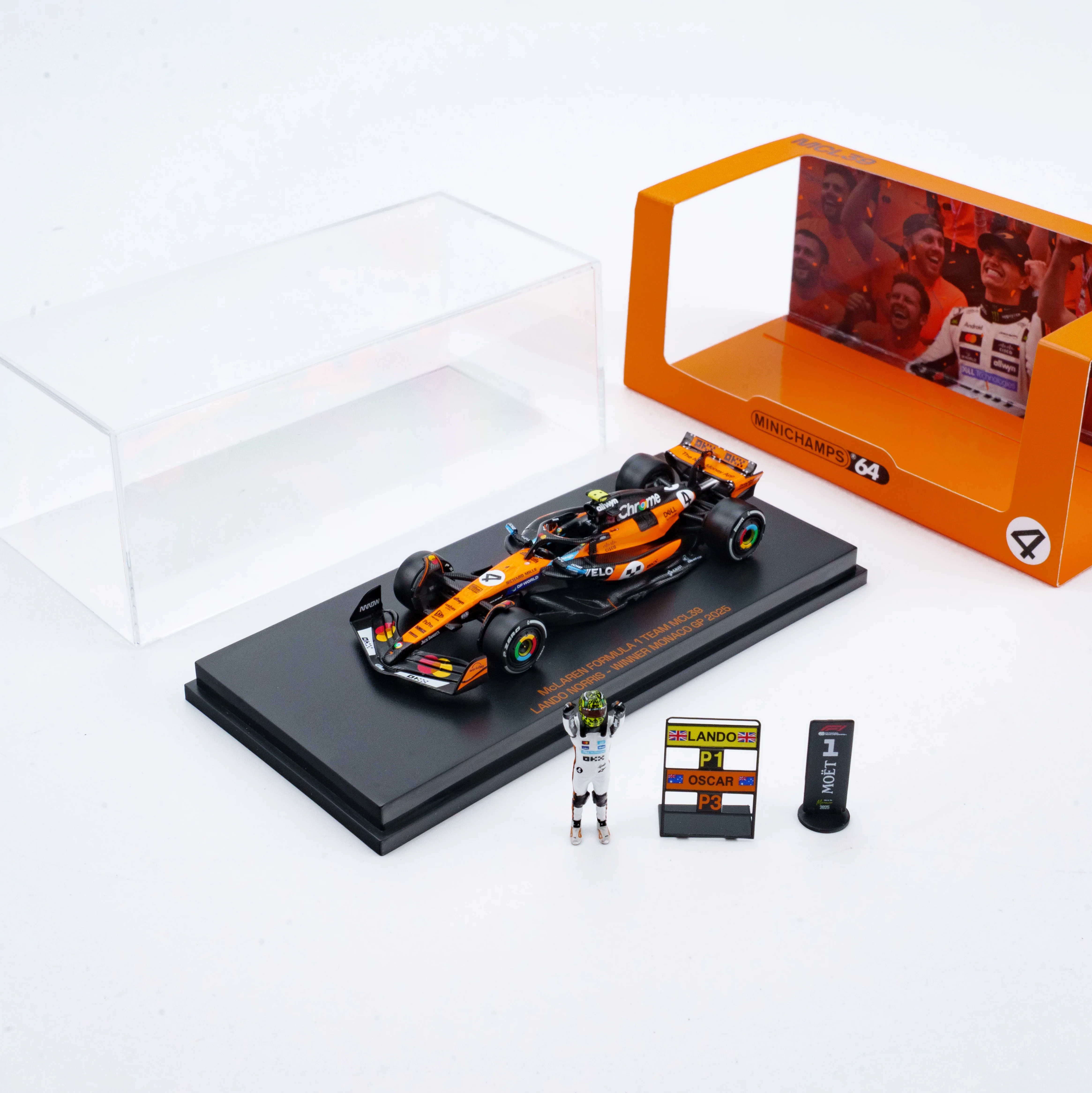 Scale 1:64 Lando Norris Winner Monaco GP 2025 McLaren MCL39 With Figurine & Pitboards- 1:64 Minichamps Model Car